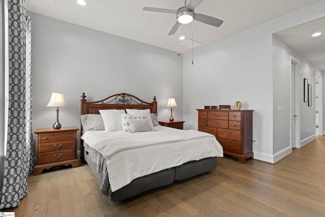 bedroom with recessed lighting, baseboards, wood finished floors, and a ceiling fan