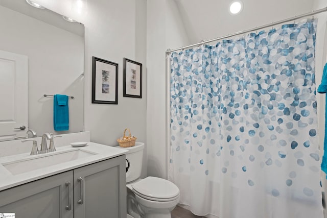 full bath featuring toilet and vanity