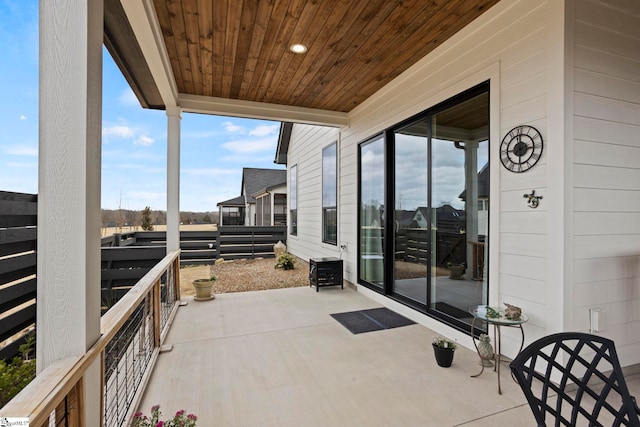 view of patio featuring a balcony