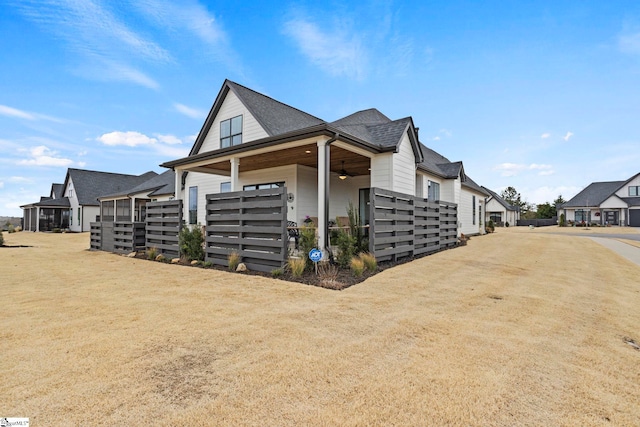 view of side of home featuring a shingled roof