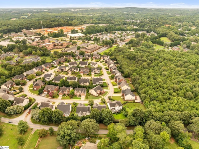 aerial view with a residential view and a view of trees