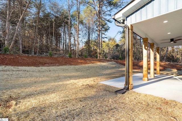 view of yard featuring a patio and a ceiling fan