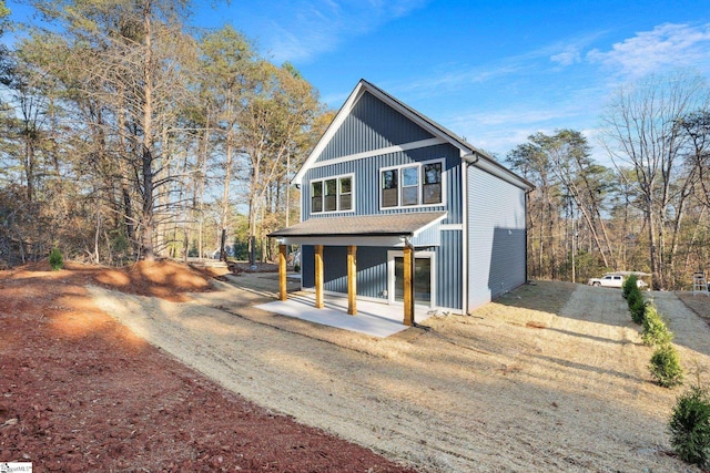 view of front of home featuring board and batten siding and covered porch