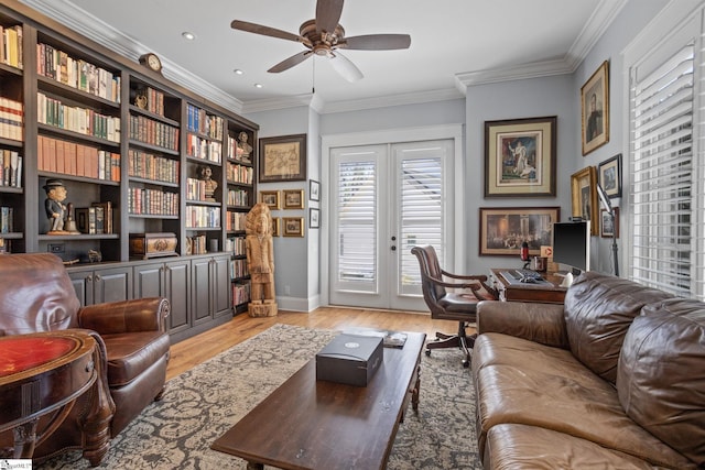 living area featuring french doors, crown molding, recessed lighting, a ceiling fan, and light wood-type flooring