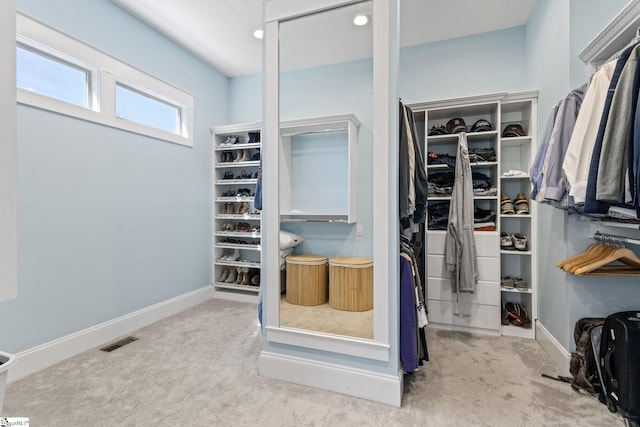 walk in closet featuring carpet and visible vents