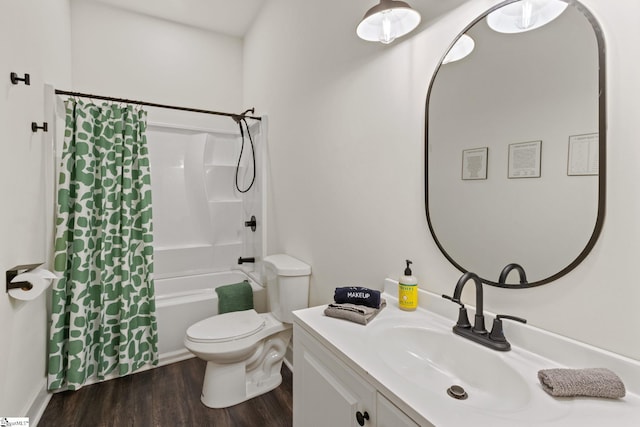 bathroom with shower / bath combo with shower curtain, vanity, toilet, and wood finished floors