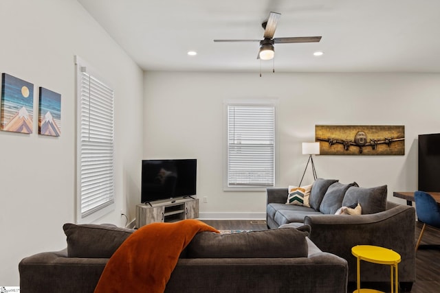 living area with dark wood-style floors, recessed lighting, baseboards, and a ceiling fan