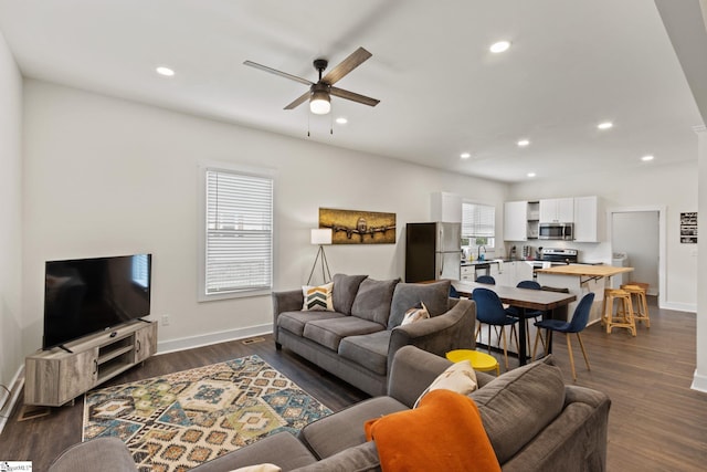 living area featuring dark wood-style floors, recessed lighting, ceiling fan, and baseboards