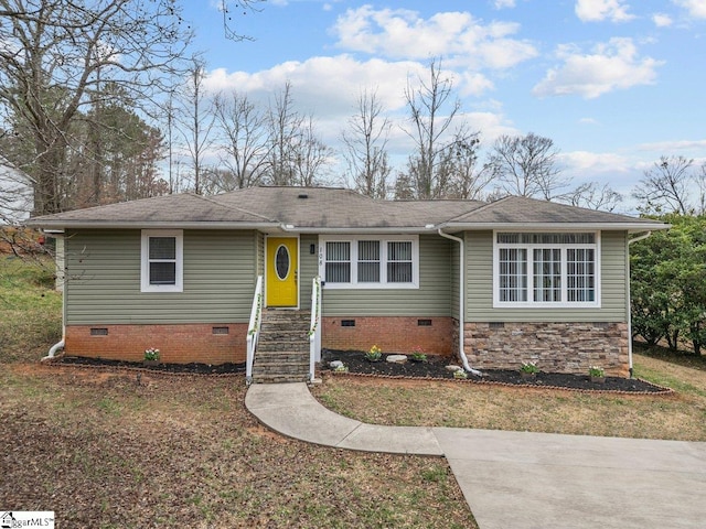 ranch-style home with crawl space and roof with shingles