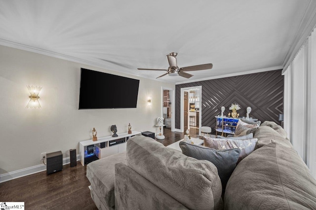 living room featuring ceiling fan, ornamental molding, dark wood-style flooring, and baseboards