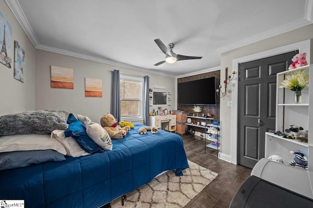 bedroom with dark wood-style floors, ceiling fan, ornamental molding, and baseboards