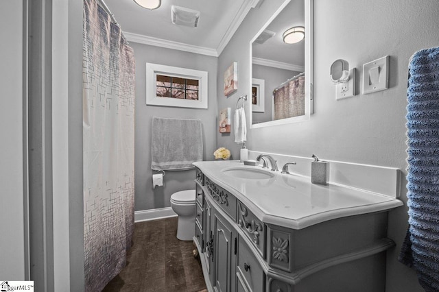 full bathroom featuring toilet, ornamental molding, vanity, wood finished floors, and baseboards