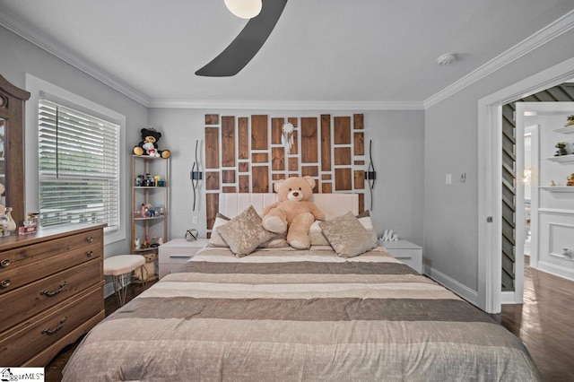 bedroom with a ceiling fan, baseboards, crown molding, and wood finished floors