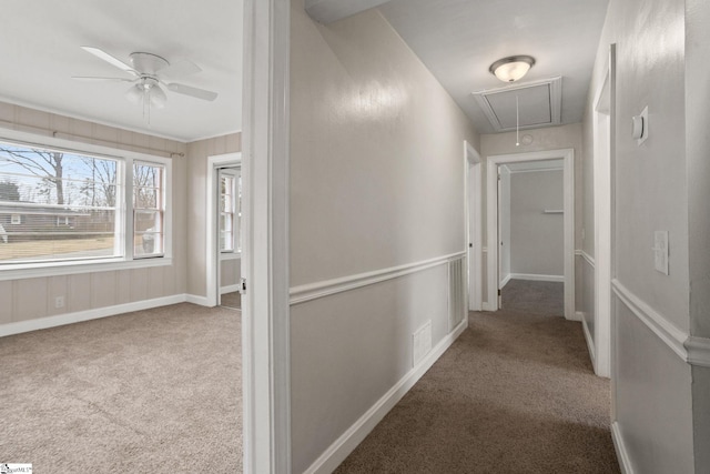 hall featuring carpet, attic access, visible vents, and baseboards