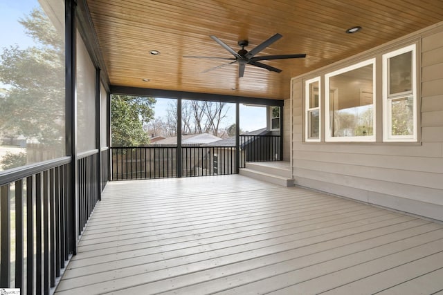 exterior space with wooden ceiling and a ceiling fan