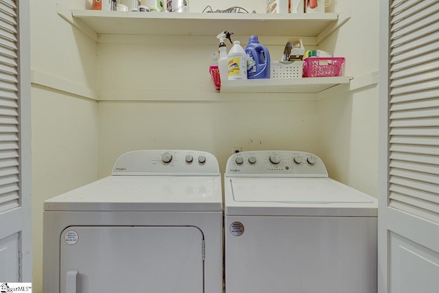 washroom featuring laundry area and separate washer and dryer