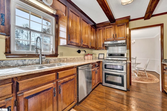 kitchen featuring beam ceiling, dark wood finished floors, stainless steel appliances, a sink, and under cabinet range hood