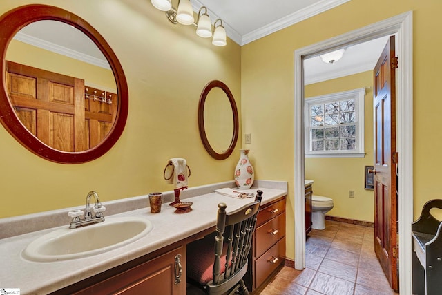 bathroom featuring toilet, baseboards, vanity, and crown molding