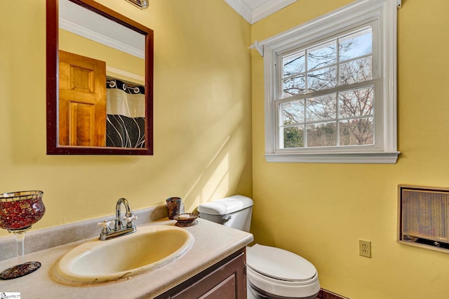 bathroom with toilet, a shower with curtain, ornamental molding, and vanity