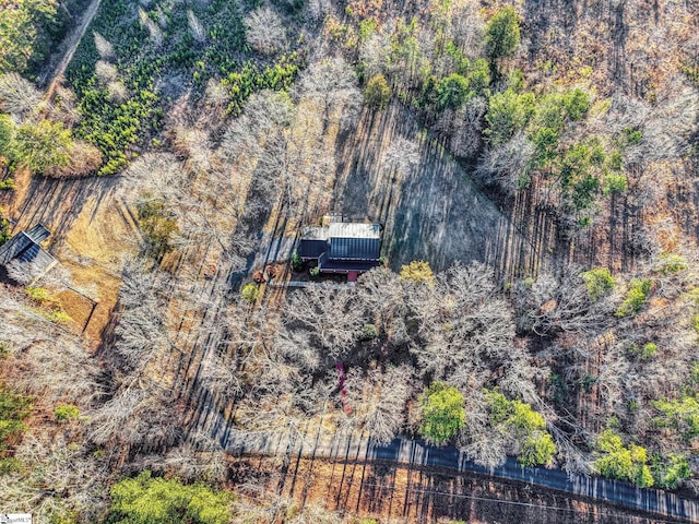 drone / aerial view with a forest view