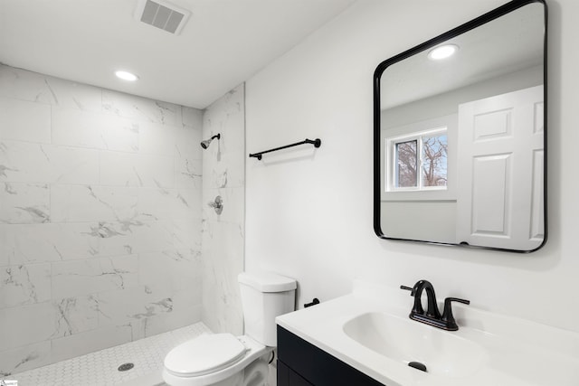 full bath featuring a stall shower, visible vents, toilet, vanity, and recessed lighting