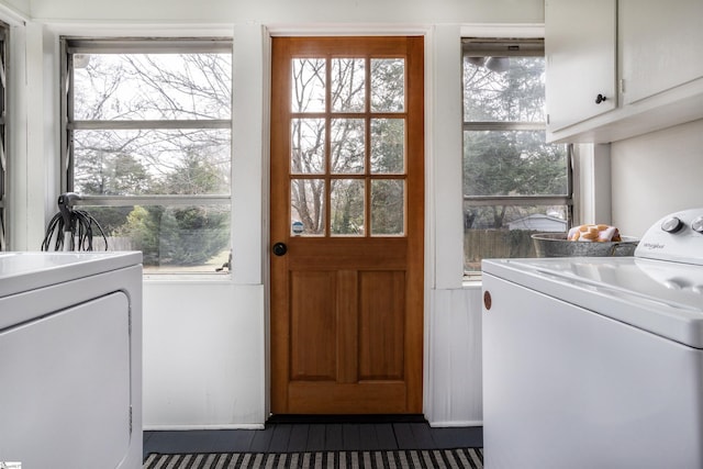 laundry area with cabinet space and washer and clothes dryer