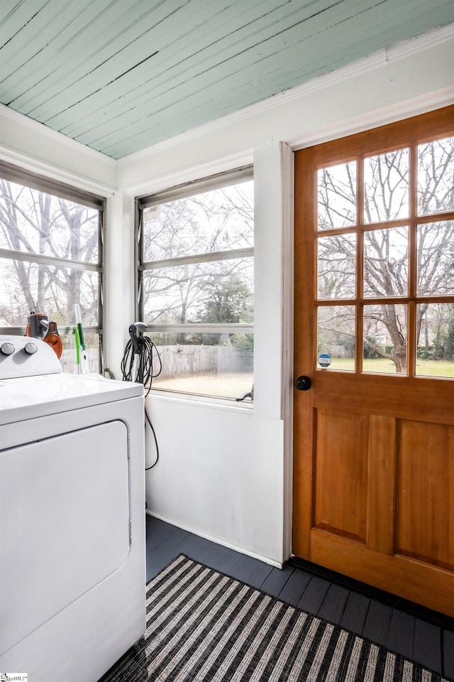 laundry area with dark wood-style floors, washer / clothes dryer, wooden ceiling, and laundry area