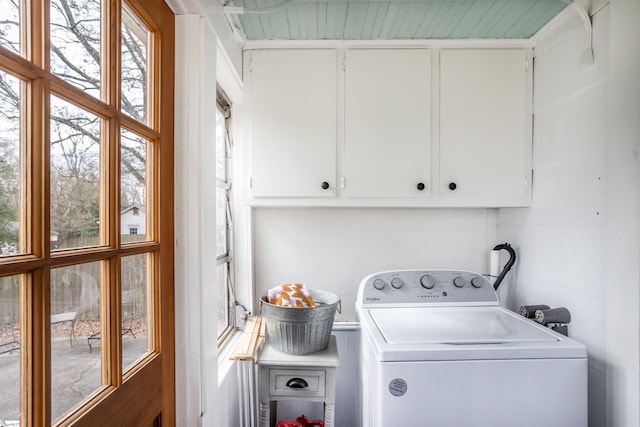 washroom featuring washer / clothes dryer and cabinet space