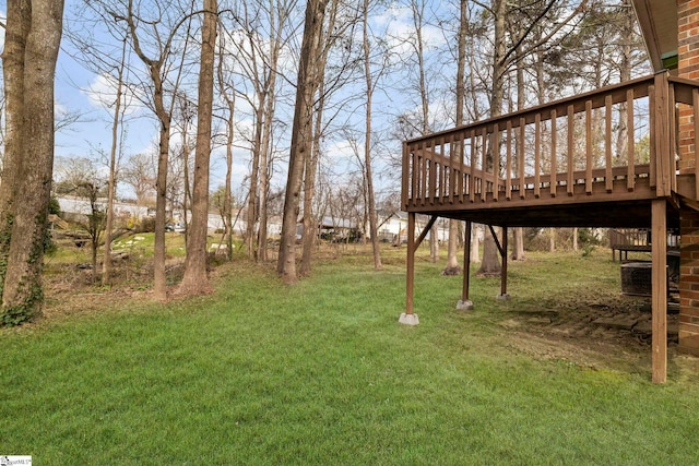 view of yard with a wooden deck