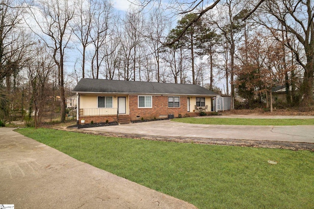 single story home with a front yard, crawl space, and brick siding