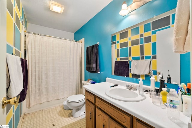 bathroom with toilet and vanity