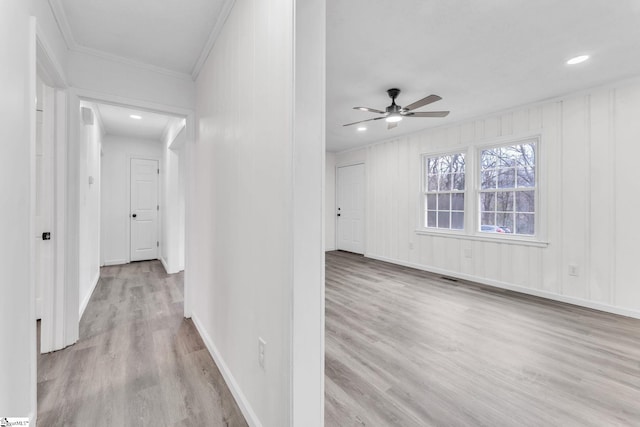 corridor featuring crown molding, recessed lighting, visible vents, wood finished floors, and baseboards