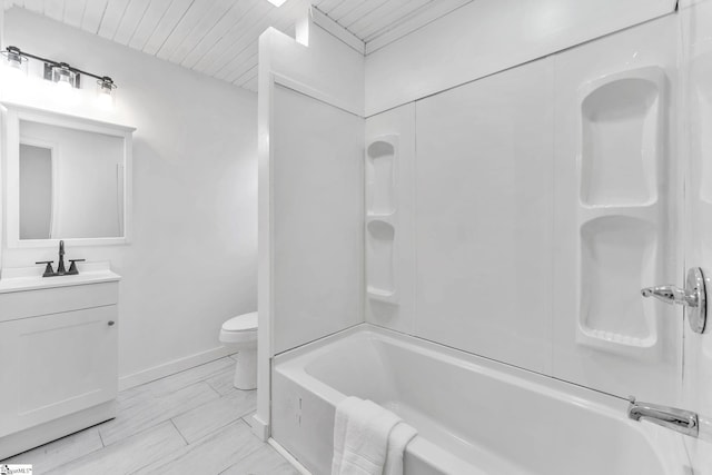 bathroom featuring toilet, wood ceiling, vanity,  shower combination, and baseboards