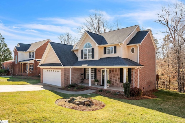 traditional-style home with a porch, an attached garage, brick siding, driveway, and a front yard