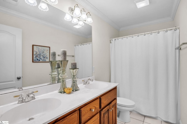 bathroom with crown molding, a sink, toilet, and tile patterned floors