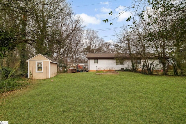 view of yard featuring an outbuilding and a storage unit