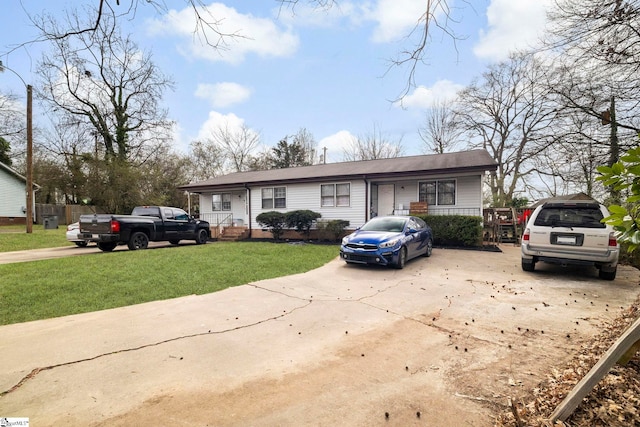 single story home with driveway and a front lawn