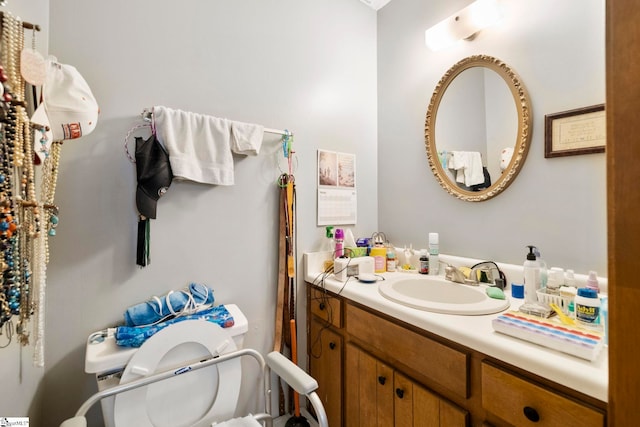 bathroom featuring toilet and vanity