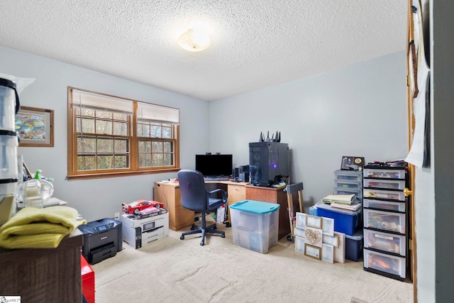 office space with carpet floors and a textured ceiling