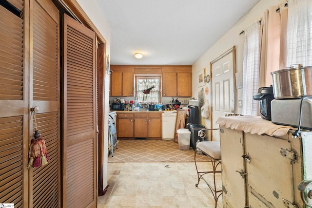 kitchen featuring light countertops and brown cabinets