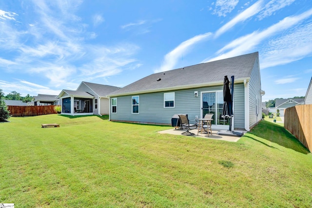 back of property featuring a patio area, fence, and a yard