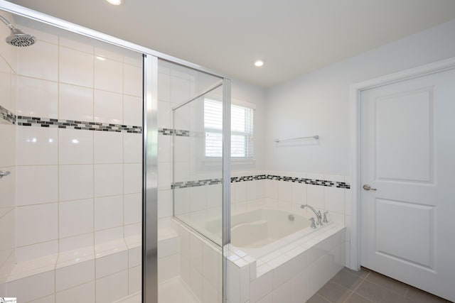 bathroom featuring recessed lighting, a garden tub, a shower stall, and tile patterned floors