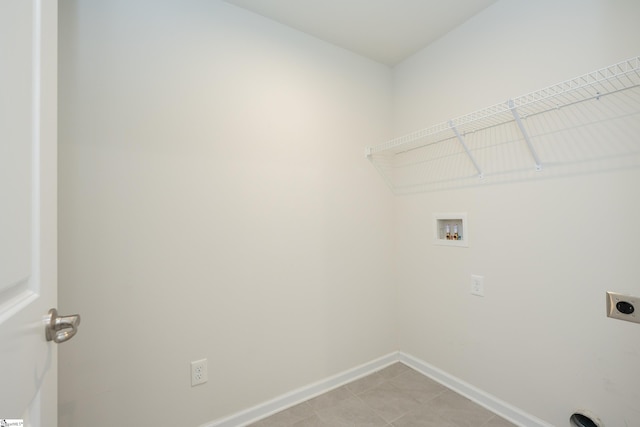 laundry room featuring baseboards, laundry area, washer hookup, and hookup for an electric dryer