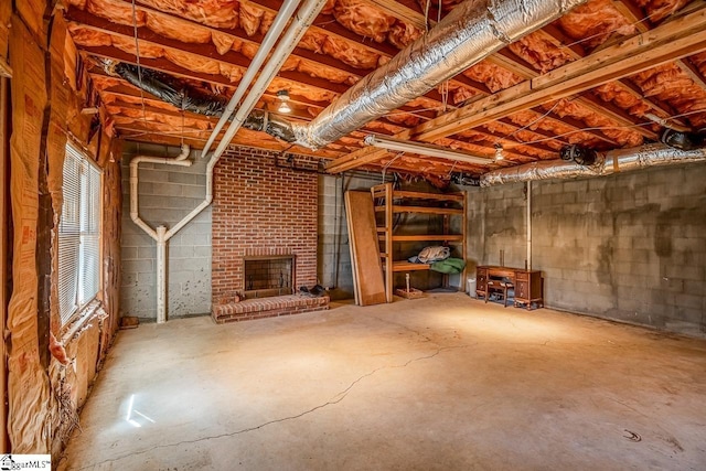 below grade area featuring a brick fireplace