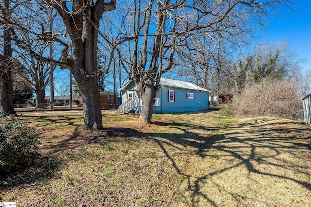 exterior space featuring crawl space and a yard