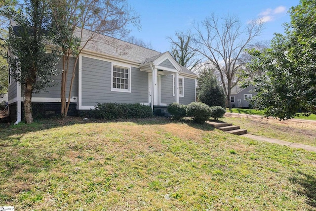 view of front of home with a front yard