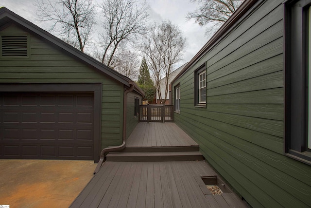 wooden deck with a garage