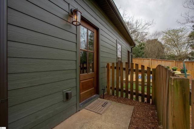 property entrance featuring fence