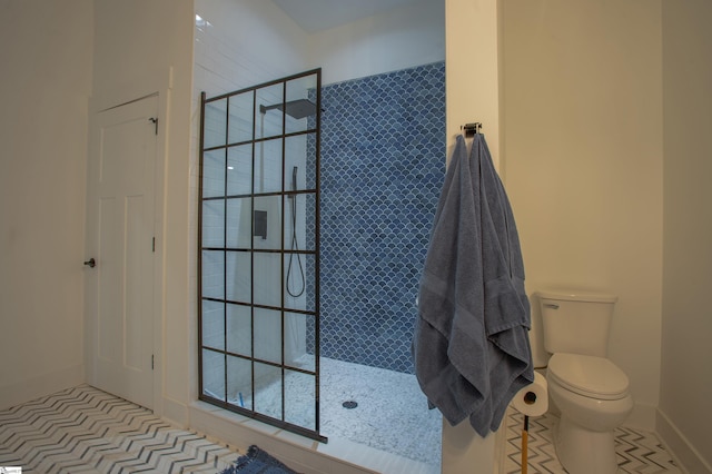 bathroom featuring toilet, walk in shower, and tile patterned floors