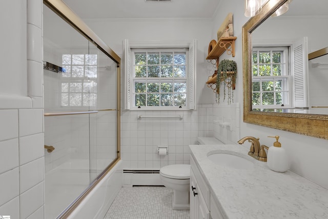 full bath with a baseboard heating unit, ornamental molding, toilet, and tile walls